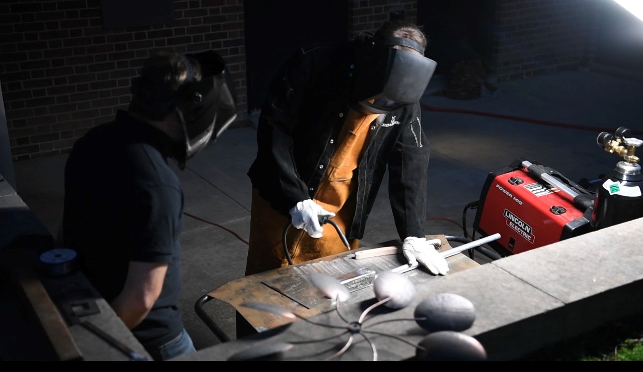 Student learning to weld in an Ideaworks Lab at Washington College