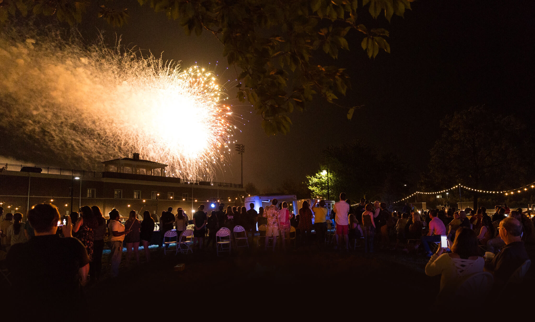 Washington College students take in the fireworks display at the all campus picnic