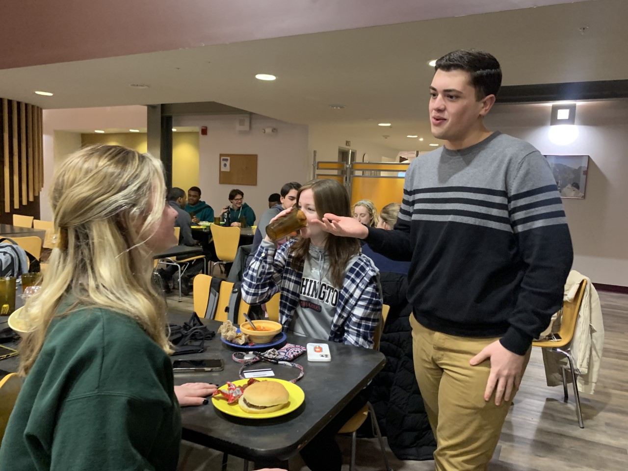 Stephen Hook, Class of 2025 President, meets with his classmates over dinner