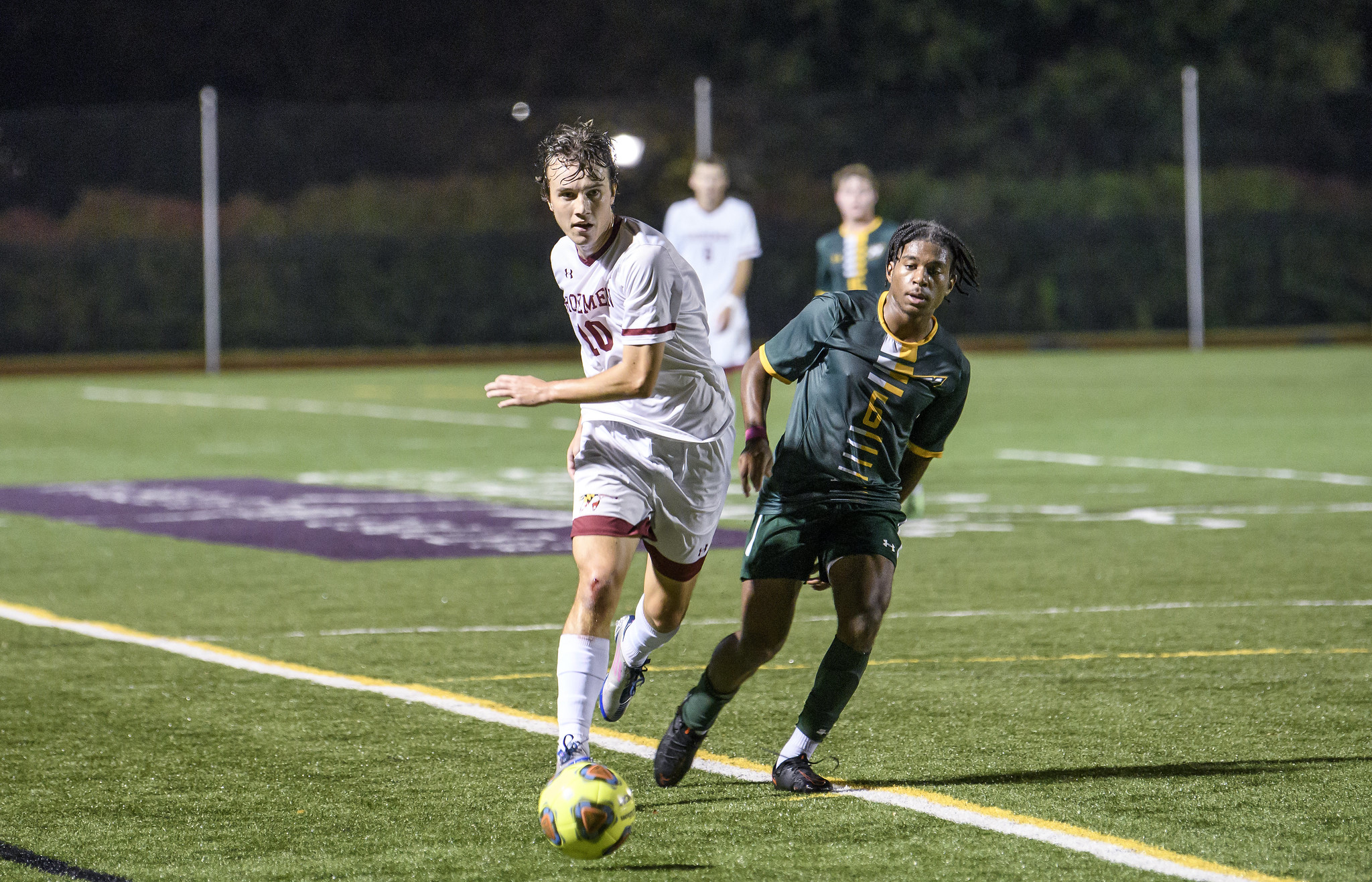 James Strine wins the ball in mens soccer victory over McDaniel