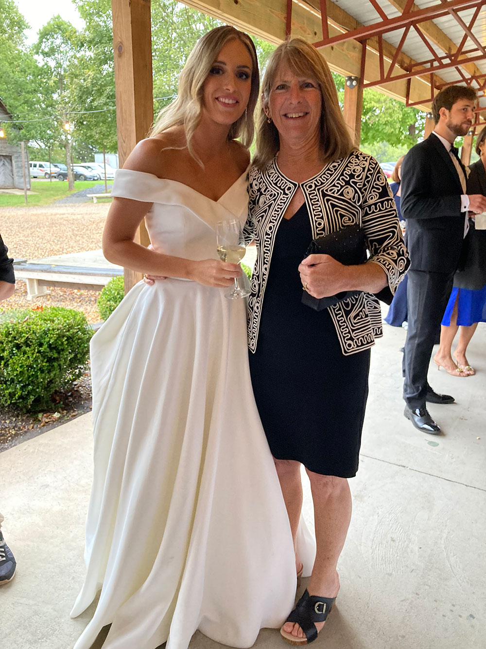 Katie Gorman '18 celebrated her wedding to Cody Weiler '18 with Head Swim Coach Kim Lessard in attendance.